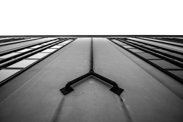 Upended Architecture ~ A steep ascent of converging symmetry, pulling the weight of the structure toward a blank, absolute sky.